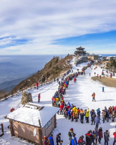 DEOGYUSAN,KOREA - JANUARY 1: Tourists taking photos of the beautiful scenery and skiing around Deogyusan,South Korea on January 1, 2016.